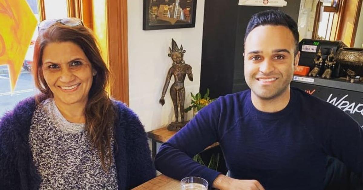 Gayatri and Kunal Dhawan posing in a cafe.