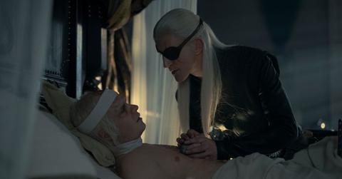 Aemond giving Aegon something in 'House of the Dragon'