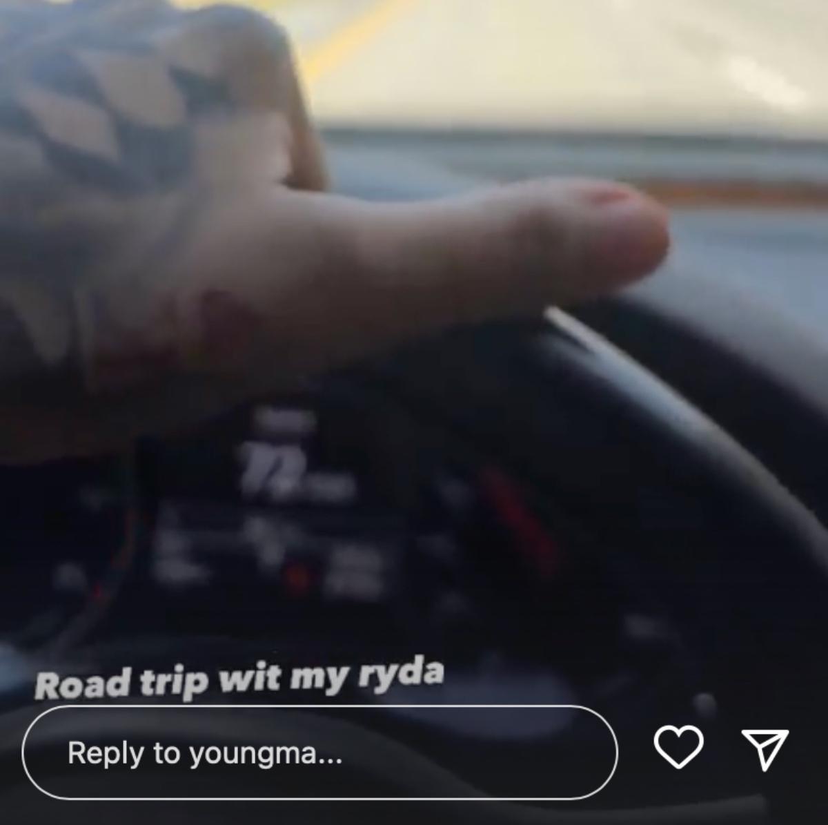 A screenshot of Young M.A. driving