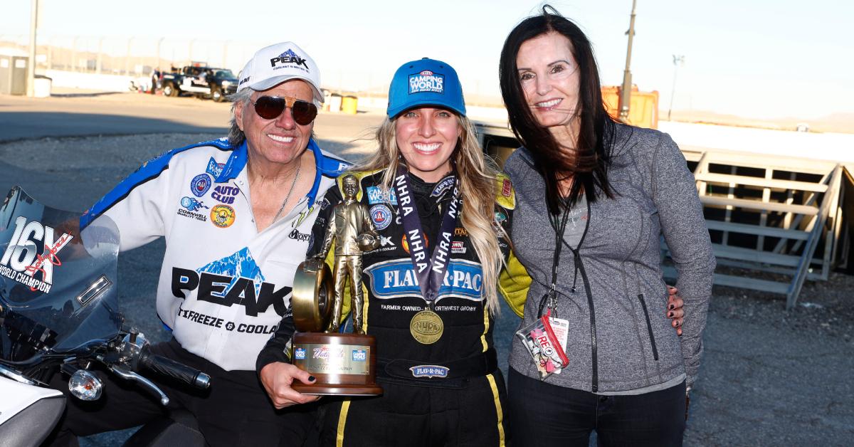 John Force poses for a photo with his daughter Brittany Force and his wife Laurie at the NHRA Nevada Nationals on Oct. 30, 2022, at The Strip at Las Vegas Motor Speedway in Las Vegas.