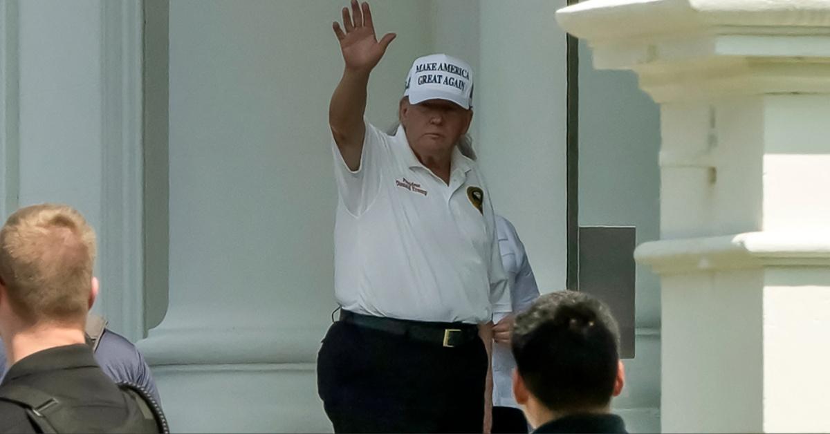 Donald Trump wearing a MAGA hat. 