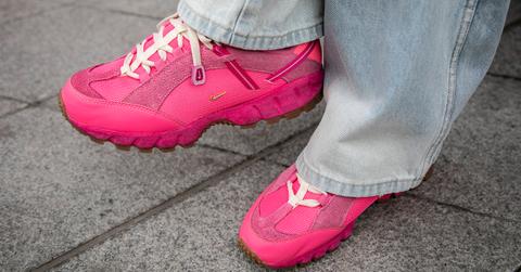 A pair of pink sneakers by Nike x Jaquemus