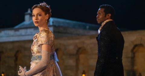 Francesca Bridgerton and Lord Kilmartin standing outside.