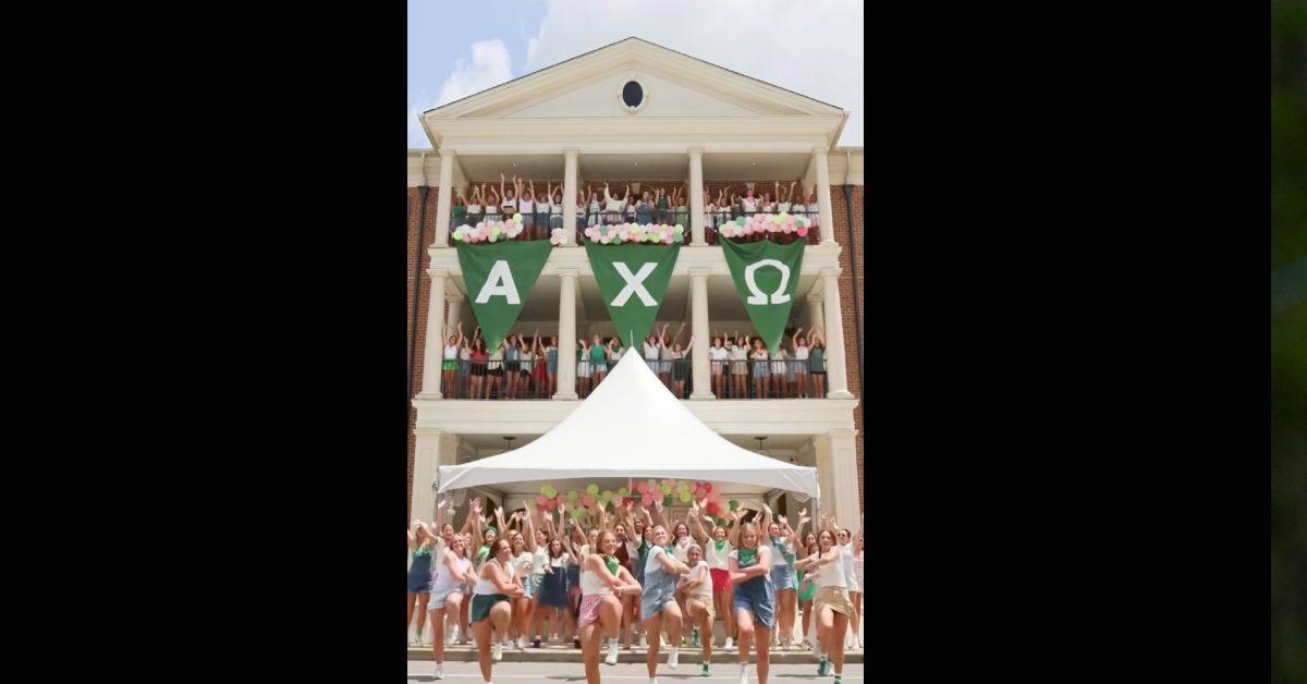 Alpha Chi Omega doing a choreographed dance in front of their house.