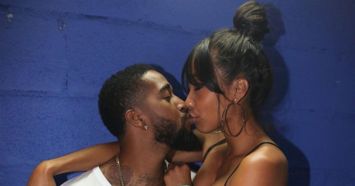 Omarion and Apryl Jones share a kiss at DJ Prostyle's 3rd Annual Birthday Bash on April 30, 2014.