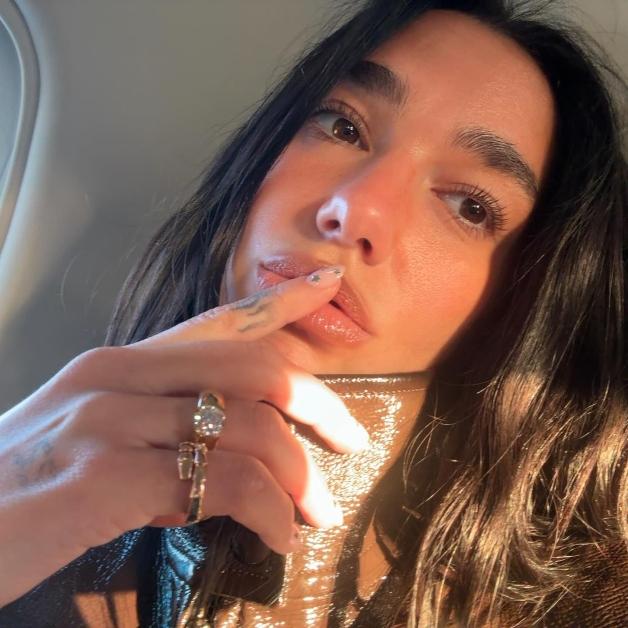 Dua Lipa shows off her engagement ring