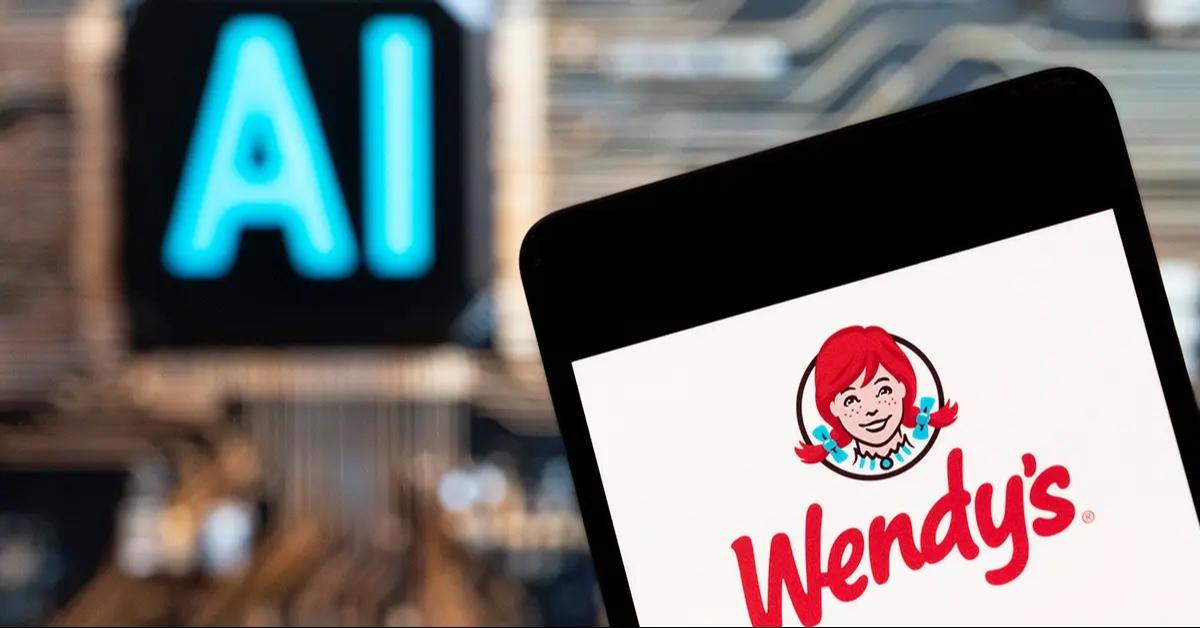 A close-up of the Wendy's app with the letters AI in the background.