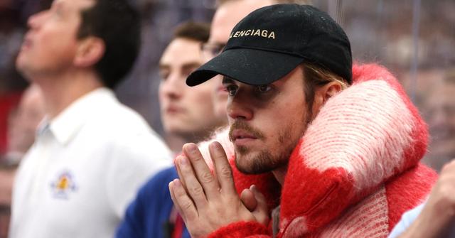 Justin Bieber looks on from the bench area of Team Matthews during their game against Team McDavid during the 2024 Honda NHL All-Star Game at Scotiabank Arena on February 03, 2024 in Toronto, Ontario, Canada. (Photo by Dave Sandford/NHLI via Getty Images)