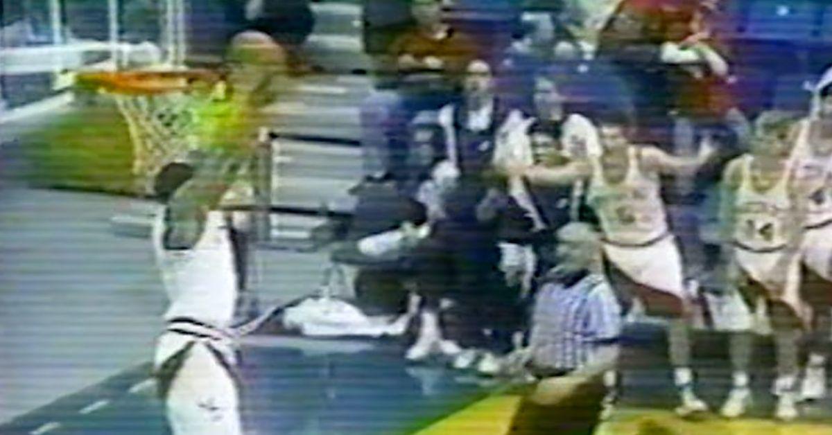 Schea Cotton dunking in a high school basketball game. 