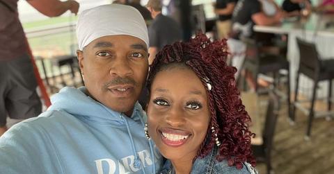 Deon and Karen smiling at a restaurant and both wearing blue