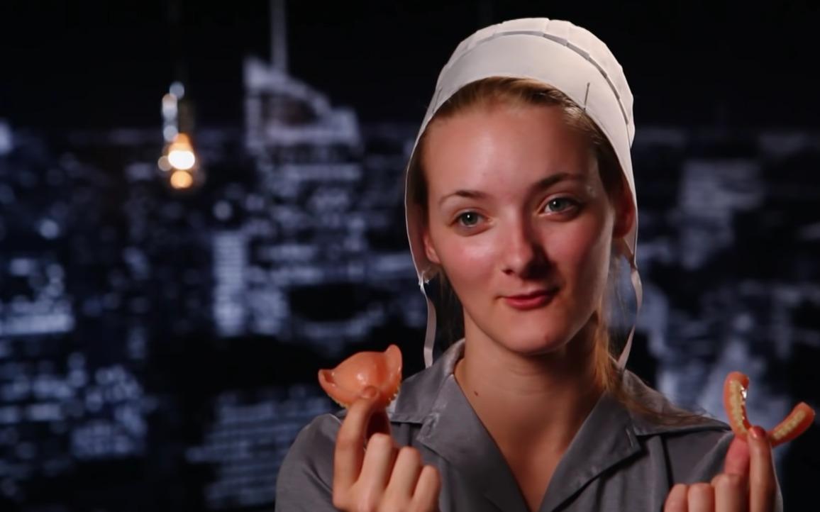 Rebecca Schmucker from 'Return to Amish' holding her dentures.