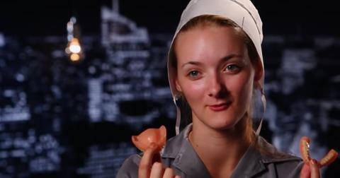 Rebecca Schmucker from 'Return to Amish' holding her dentures.