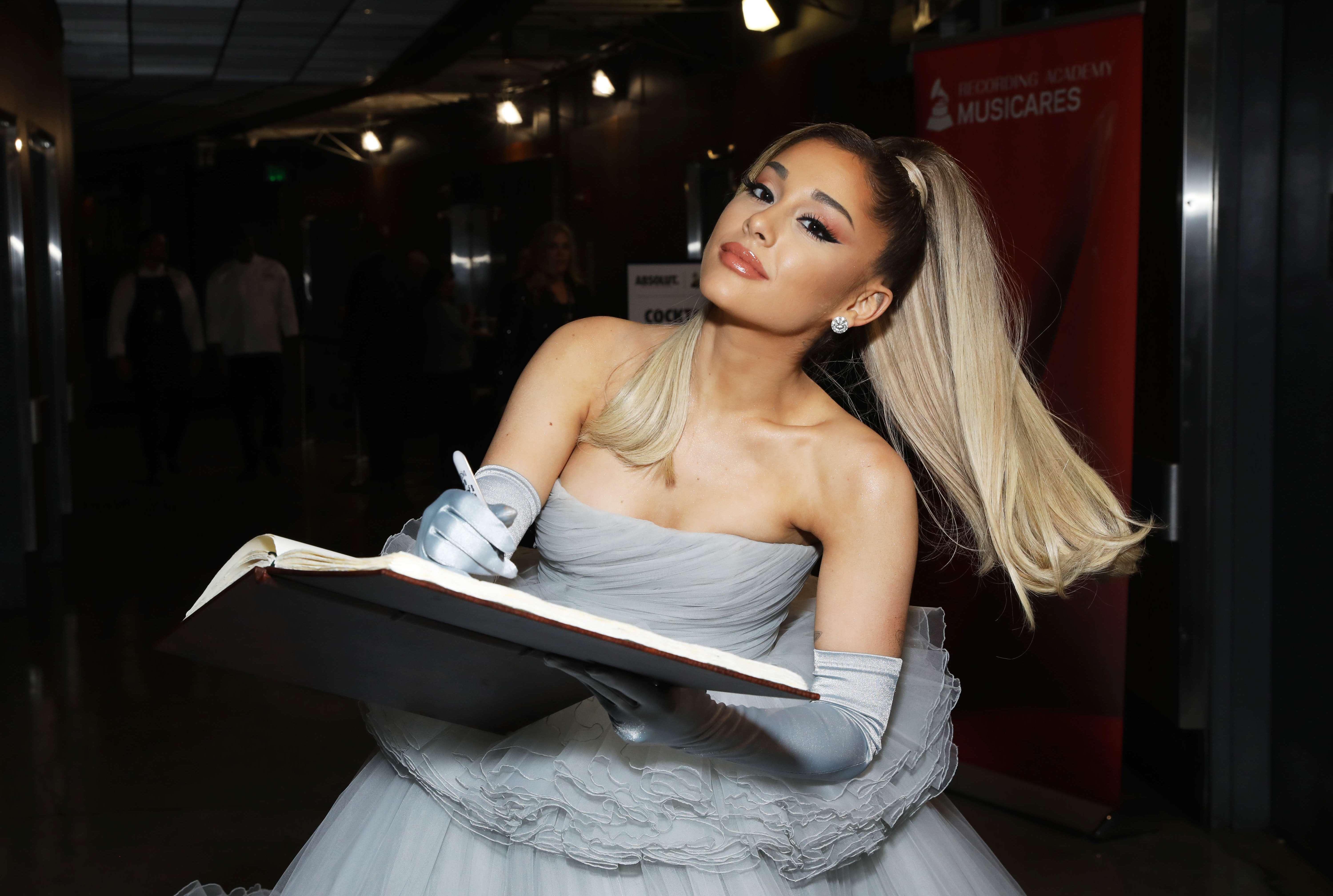 Ariana Grande wearing gloves to the 62nd Grammy Awards