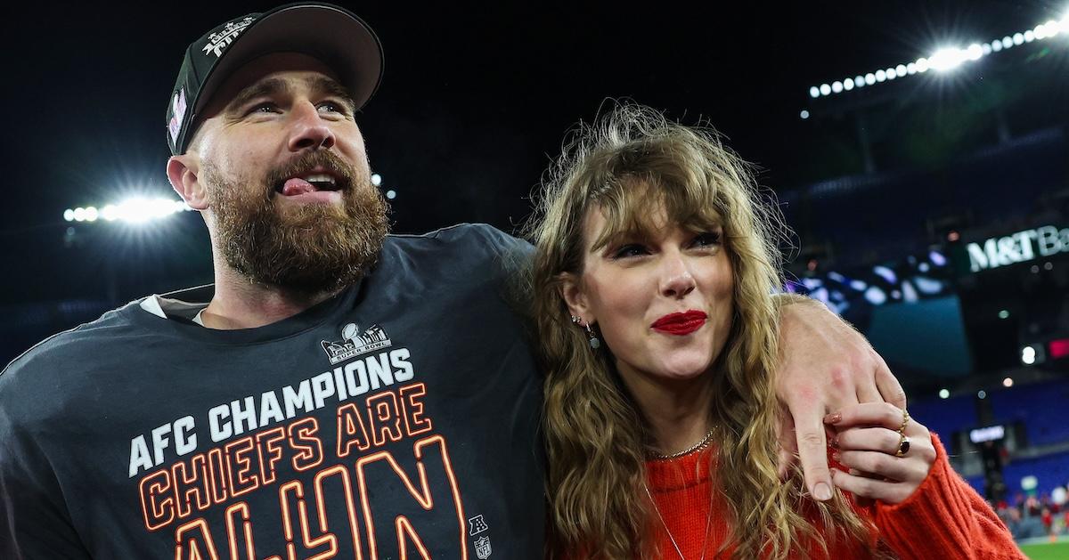 taylor swift travis kelce on the field after chiefs win