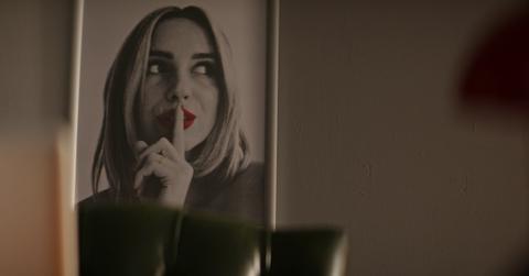 Woman does the classic Ashley Madison "shh"