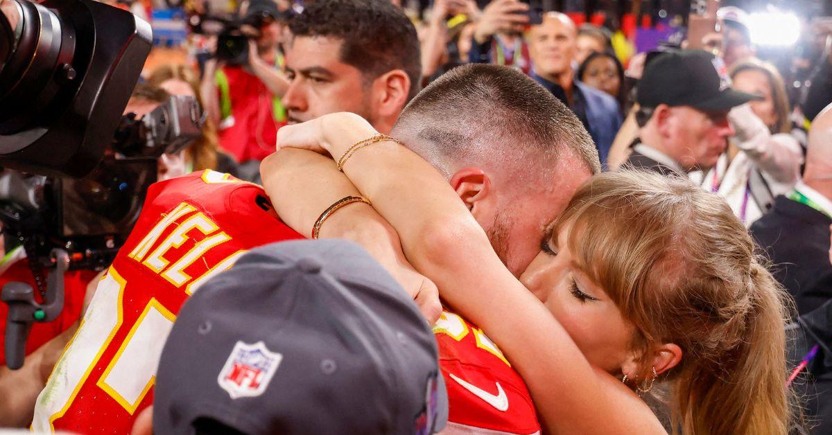 Taylor Swift and Travis Kelce hugging after the 2024 AFC Championship Game.
