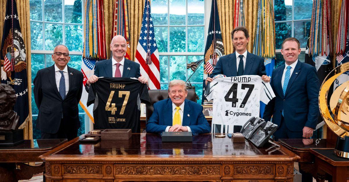 Trump with members of the FIFA organization holding jerseys.