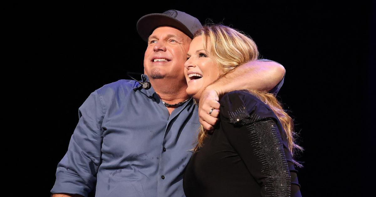 Garth Brooks and Trisha Yearwood performing at a benefit concert.