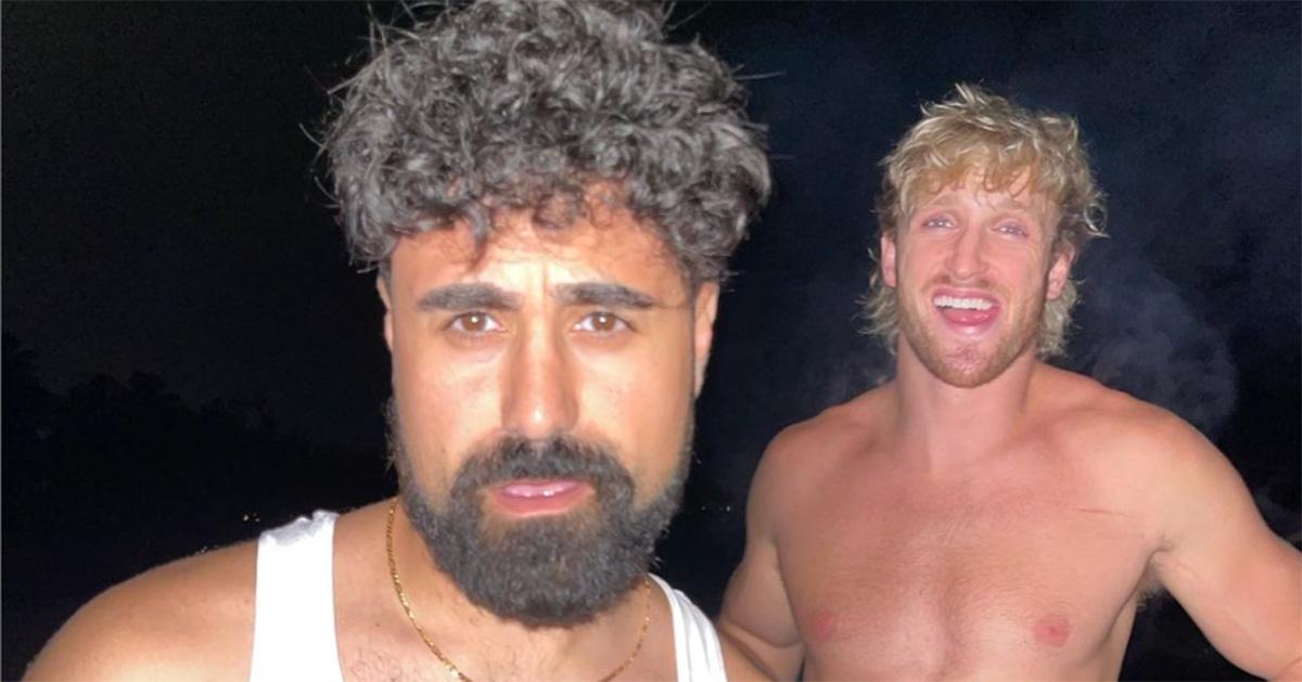 George Janko poses with Logan Paul, who is shirtless. 