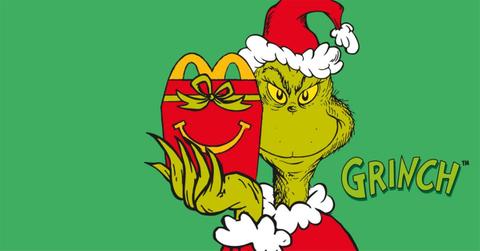 The Grinch holding a Happy Meal box.