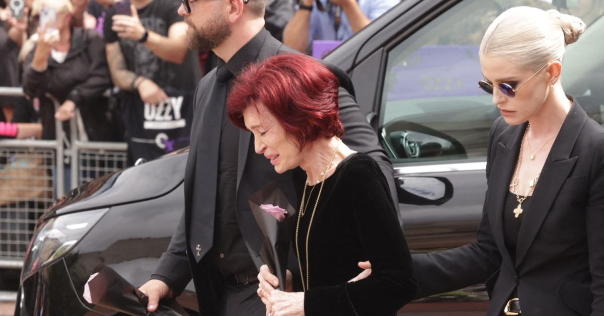 Sharon Osbourne wept as she walked to place a flower on Ozzy's memorial, supported by their children Jack and Kelly