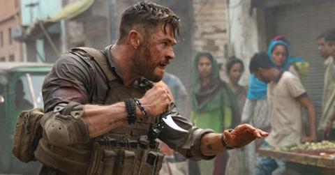 who was the guy at the end of extraction cover