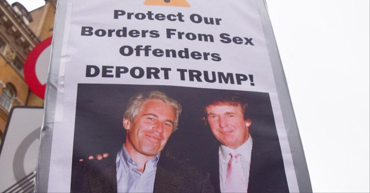 Jeffrey Epstein and Donald Trump's picture on a protester's sign. 