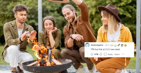 A group of friends around a fire pit.