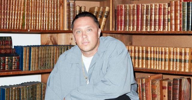 Chris 'Spanto' Printup in front of bookshelves