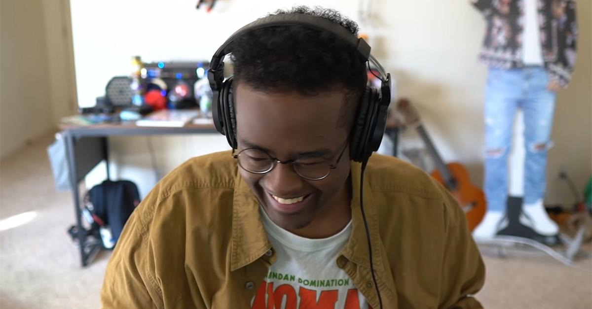 Twomad smiling with headphones on