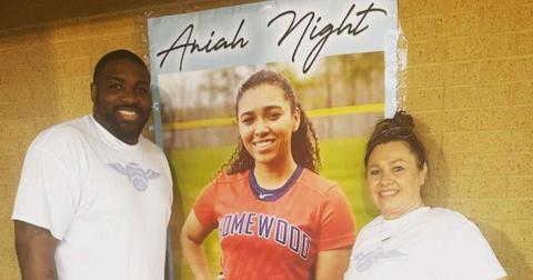 Walt Harris and Angela Hayley-Harris flank a photo of their daughter, Aniah Blanchard.