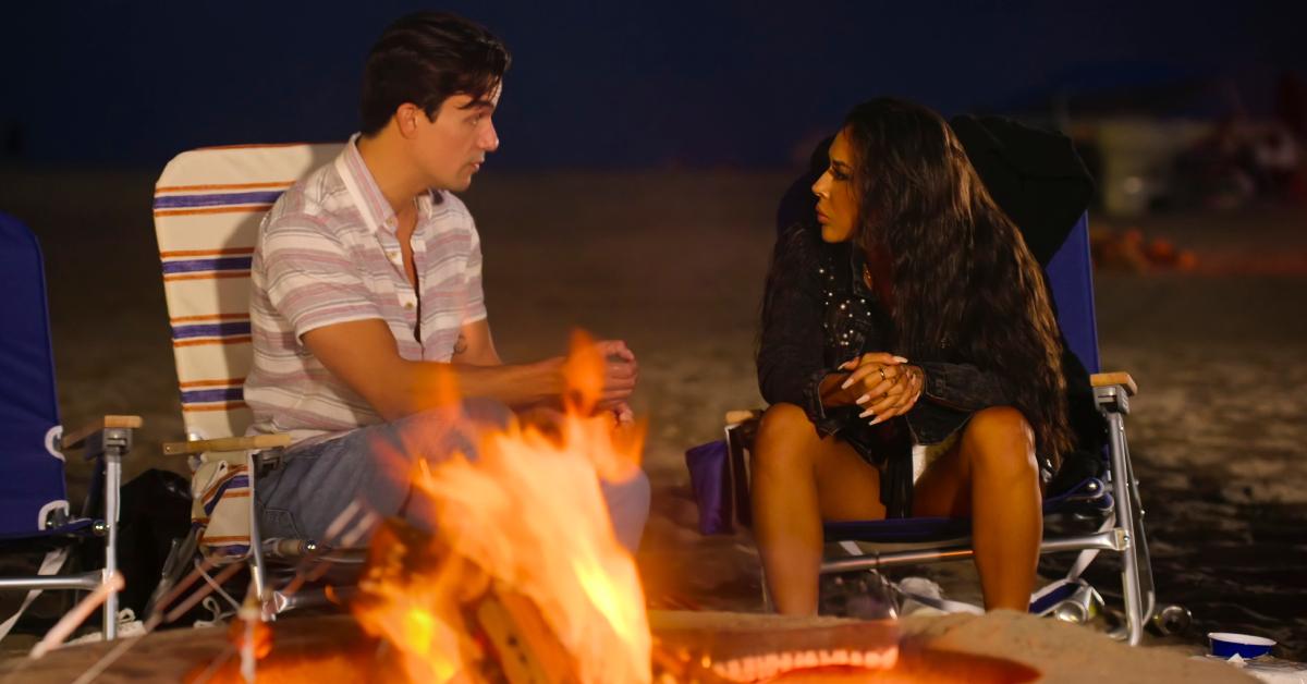Gio Helou and Kayla Cardona have a heated chat during a bonfire night on the beach in Season 3 of 'Selling the OC.'