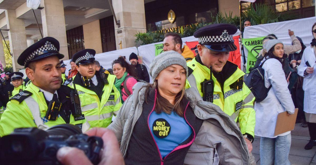 Greta Thunberg being arrested at an oil protest in 2023.