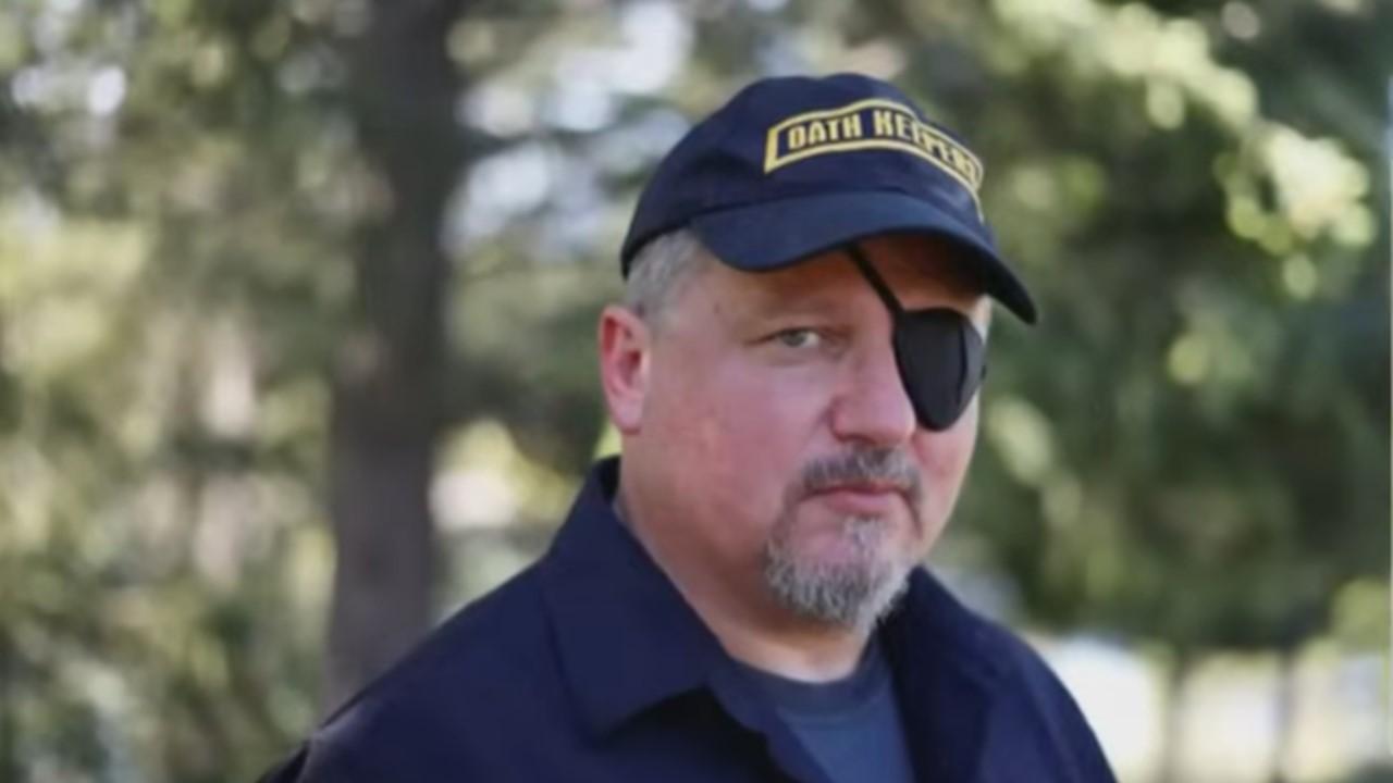 Stewart Rhodes wearing an eye patch at Oath Keepers baseball cap