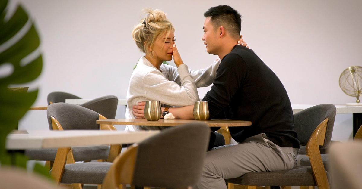 Kacie and Patrick from Love Is Blind sit at a table together.