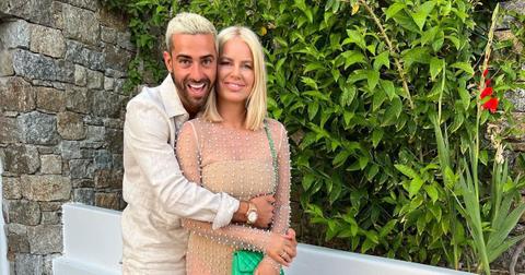 (l-r): Sergio Carrallo and Caroline Stanbury embracing outside.