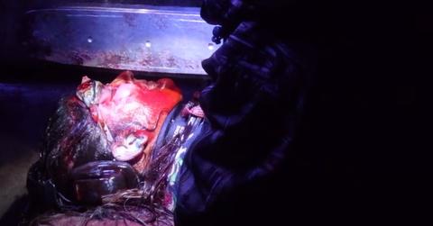 A woman at McKamey Manor covered in blood