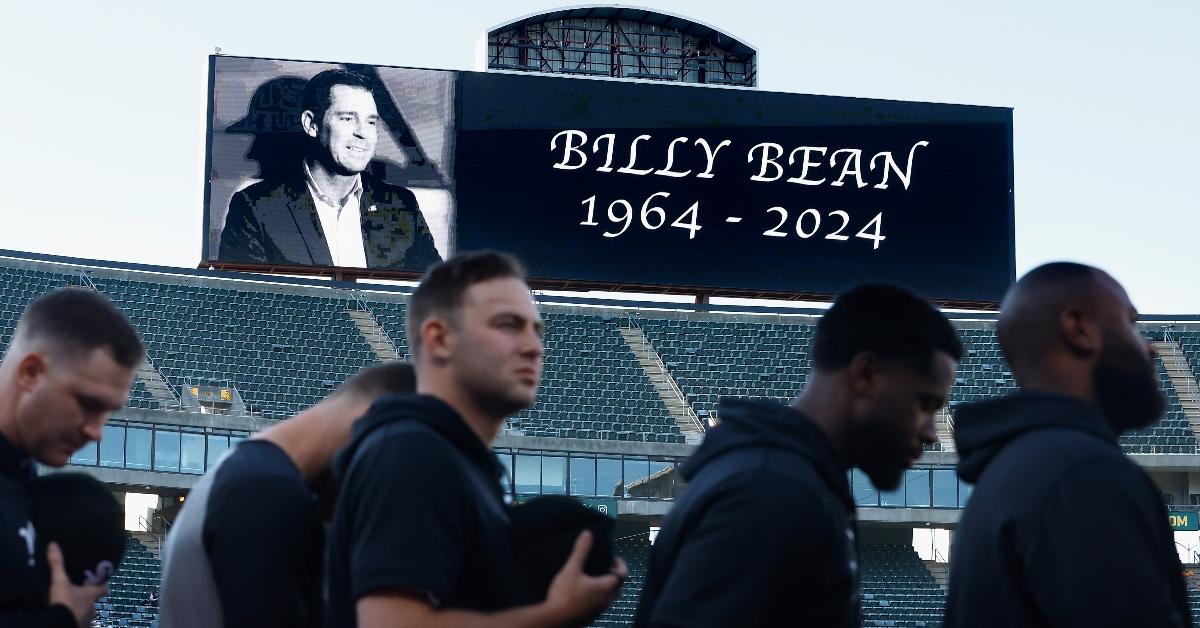 Players pause for a moment of silence in memory of Billy Bean before the game between the Oakland Athletics and the Chicago White Sox at Oakland Coliseum on August 06, 2024 in Oakland, California. Bean, a former MLB player and formerly the league’s senior vice president of diversity, equity and inclusion, died today. He was 60. (Photo by Lachlan Cunningham/Getty Images)