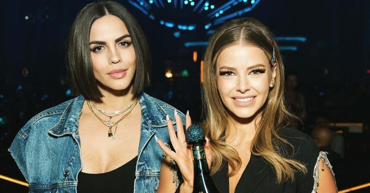 Katie Maloney and Ariana Madix in a club holding a bottle of Patron