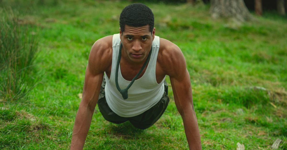 Carl Lariviere doing a push-up while filming a scene from 'Snowflake Mountain'