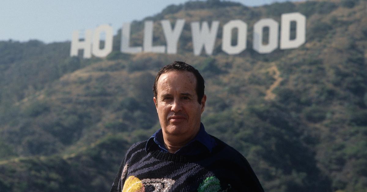 Kenneth Anger poses in front of the Hollywood sign in Los Angeles.