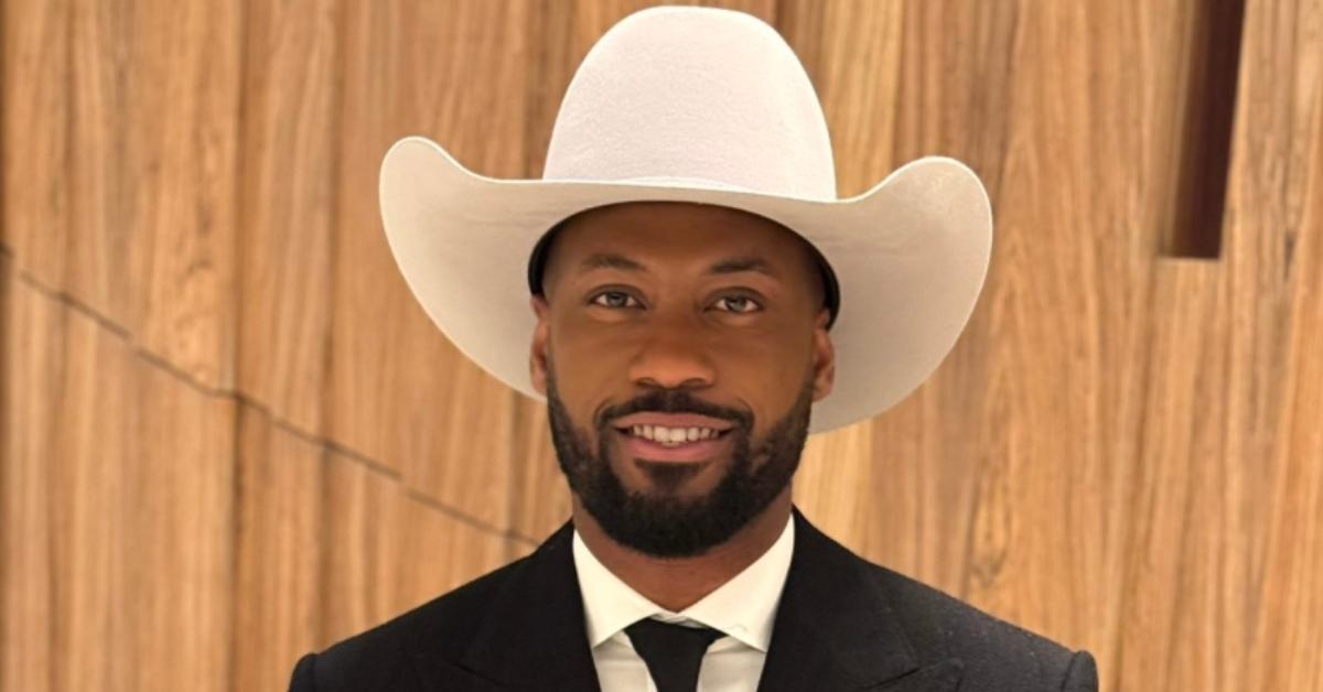 Lawrence Jones wearing a white cowboy hat.