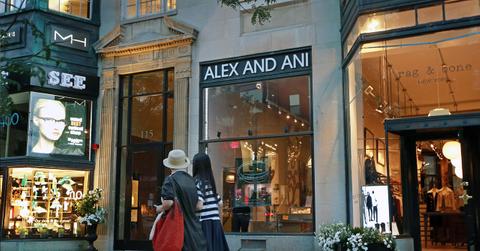 Two women walk past an Alex and Ani store in Boston