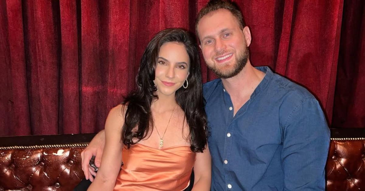 Vanessa and Dave from The Ultimatum sit at a table together on New Year's Eve