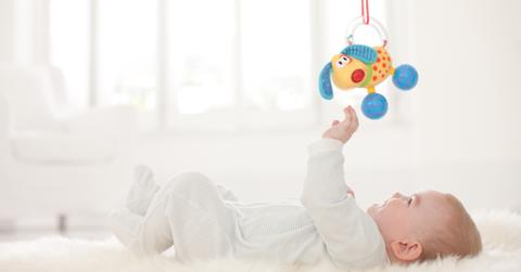 Baby Playing with Toy Getty