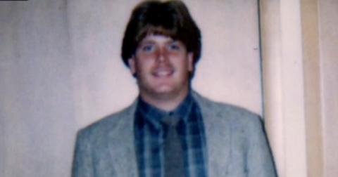 Corey Wieneke in a gray suit jacket and plaid shirt