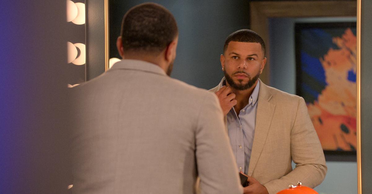 Tyler Francis fixes his collar in the mirror on Season 7 of 'Love Is Blind'