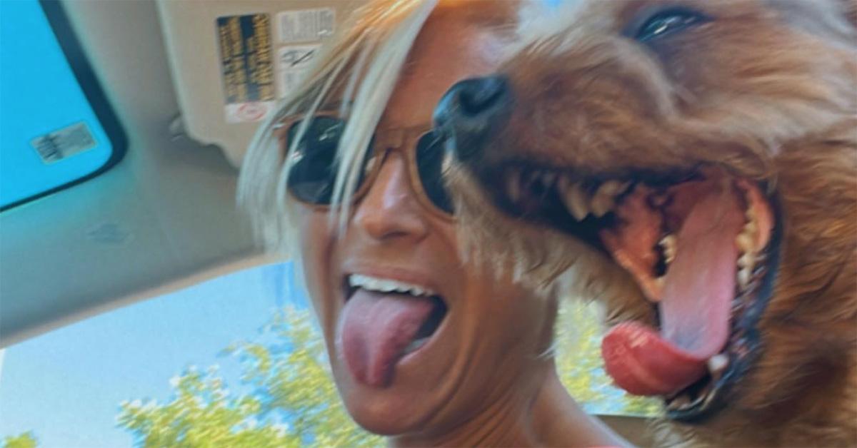 Kyle Marisa Roth with her dog Hamilton and their tongues out. 