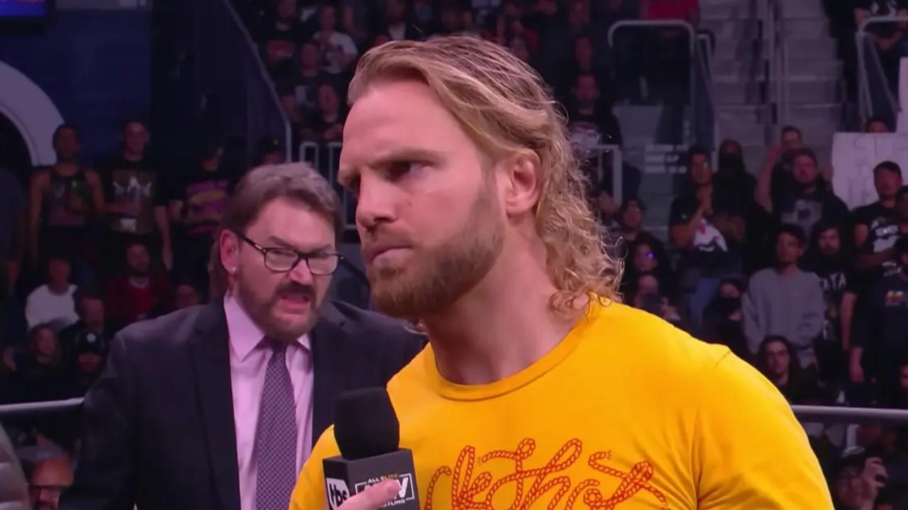 "Hangman" Adam Page speaking into a microphone