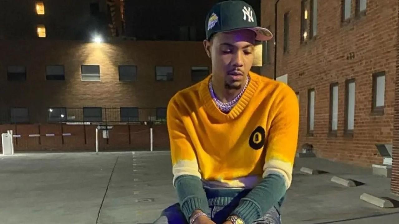 G Herbo sitting in a parking lot